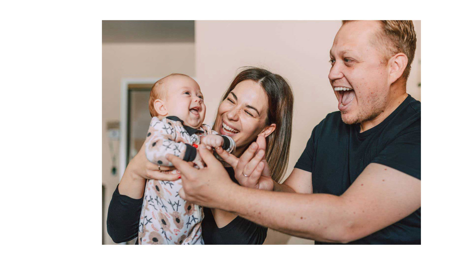 Supporting Cry-sis Helpline photo of baby with smiling parents